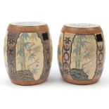 Pair of Asian ceramic garden seats in the form of drums, each hand painted and incised with panels