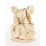 Japanese carved ivory Okimono of a fisherman with a crab, character marks to the base, 10cm high :