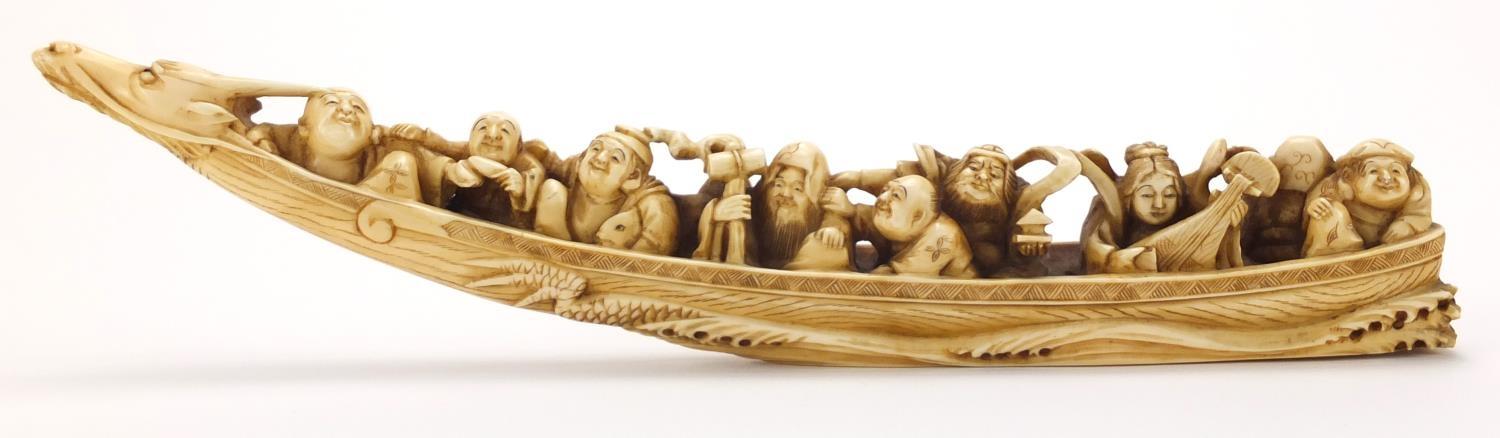 Chinese carved ivory okimono of eight figures in a dragon boat, character marks to the base : For