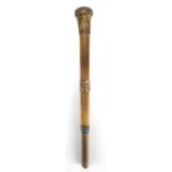 Hexagonal Rhinoceros horn walking stick handle, with gilt metal mounts, 25.5cm in length,