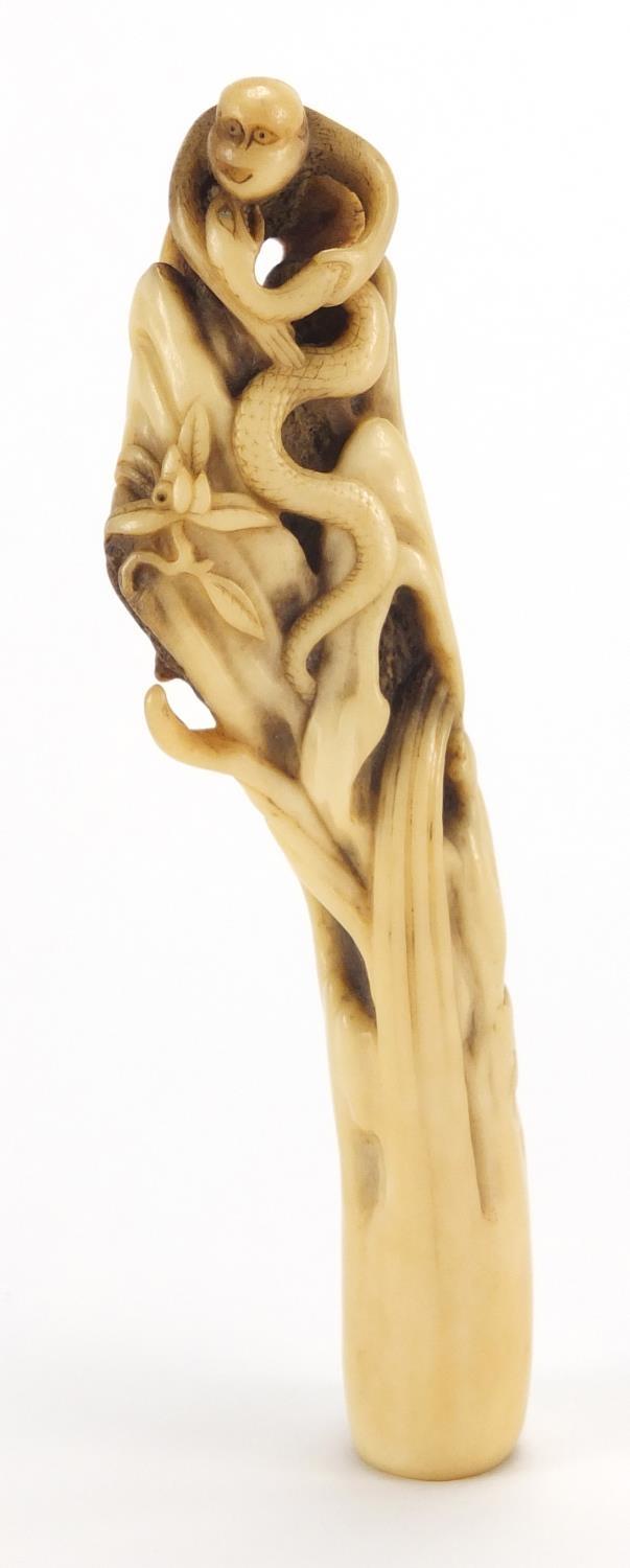 Oriental bone handle, finely carved with a monkey and snakes, 13.5cm in length : For Further