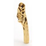 Oriental bone handle, finely carved with a monkey and snakes, 13.5cm in length : For Further