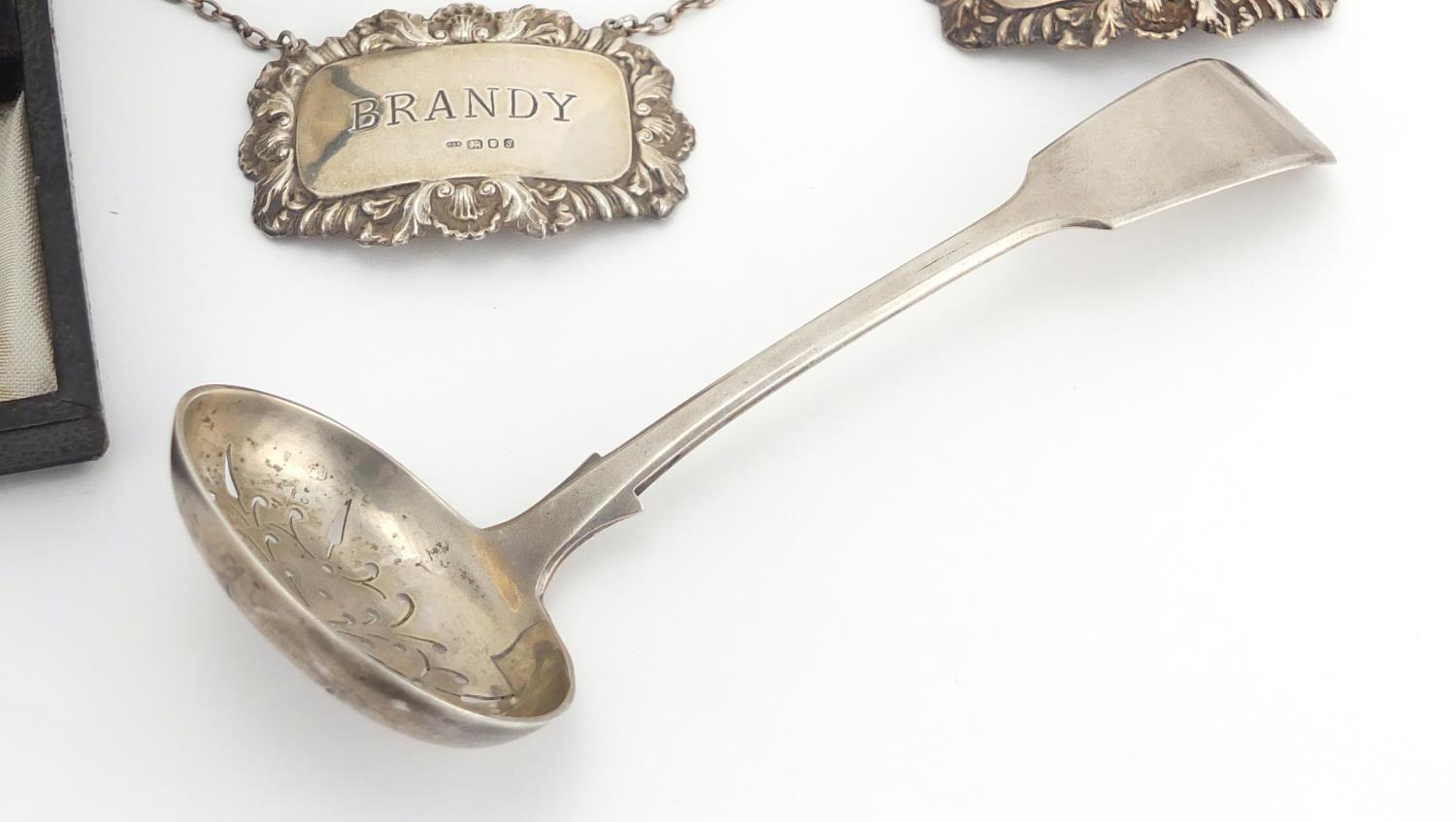 Silver items including a Victorian straining spoon, three decanter labels, a vesta and set of six - Image 4 of 6
