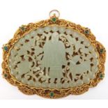 Chinese silver gilt filigree pendant housing a pale green jade panel carved with a figure, animals