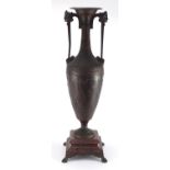19th century Neo classical patinated bronze twin handled vase, signed F Barbedienne, raised on a red
