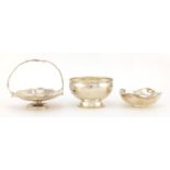 Three circular silver dishes, one with basket handle and one with inset 179? cartwheel penny,