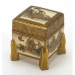 Japanese Satsuma pottery four footed box and cover, finely hand painted and gilded with sages,
