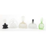 Five Art Deco crystal and glass scent bottles including a black glass butterfly and intaglio