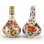 Two 19th century Derby porcelain bottle vases, hand painted and gilded in the Imari palette, painted