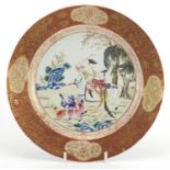 Chinese export porcelain plate, the central panel hand painted in the famille rose palette with