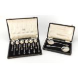 Set of six Art and Crafts silver plated spoons and forks together with a pair of table spoons, the