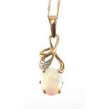 9ct gold cabochon, opal and diamond pendant on a 9ct gold necklace, the pendant 2.3cm in length,