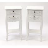 Pair of white painted night stands, each fitted with two drawers and with swag decoration, 75cm H