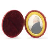 19th century oval hand painted portrait miniature of a gentleman in formal dress, with gilt aperture