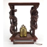 Chinese red lacquered carved wooden altar brass bell, the frame carved with two dragons, 56cm