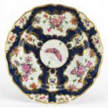 18th century Worcester shallow dish, hand painted with panels of flowers and butterflies, within