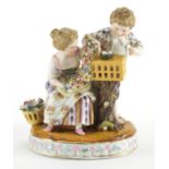 19th century continental hand painted porcelain figure group of two young figures with flowers and