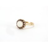 9ct cabochon opal and garnet ring size O, approximate weight 2.4g : For Further Condition Reports