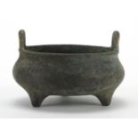 Chinese patinated bronze tripod censer with twin handles, six figure character marks to the base,