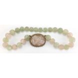 Chinese rose quartz and green hard stone pendant on bead necklace, the pendant set in an unmarked