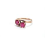 9ct gold pink stone crossover ring, size O, approximate weight 2.1g : For Further Condition