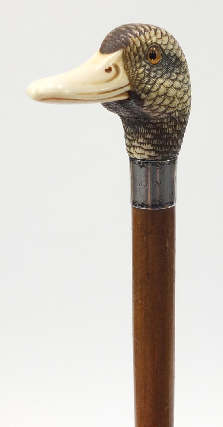 19th century parasol with carved ivory ducks head handle by Brigg & Sons, the ducks head having