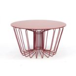Zanotta Wire table designed by Levy Arik, with circular glass top in red, plaque to the underside,