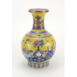 Chinese porcelain vase, hand painted in the famille rose palette with precious objects onto a yellow