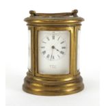 19th century miniature French brass oval brass cased carriage clock, by Henry Marc of Paris with