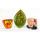 Royal Doulton Winston Churchill character jug and two Poole pottery dishes, the largest 31cm