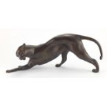 Modernist patinated bronze study of a crouching leopard, 53cm in length :For Further Condition