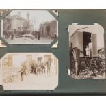Edwardian and later postcards arranged in an album, some black and white photographic including