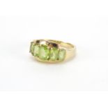 9ct gold green stone crossover ring, size P, approximate weight 4.0g : For Further Condition Reports