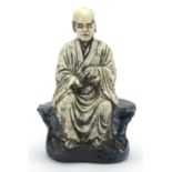 Large Chinese white and blue glazed pottery monk, character marks to the reverse, 41cm high : For