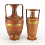 Two 19th century Danish terracotta vases by P Ipsen in the Egyptian style, each with twin handles