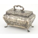 Continental silver Bombay chest shaped trinket with hinged lid, embossed with farmeing scenes,