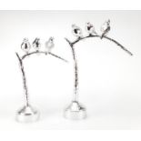 Two silvered models of three birds on a branch, the largest 51cm high : For Further Condition