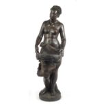 19th century floor standing terracotta figure of a semi nude African female holding a basket, in the