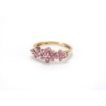 9ct gold purple stone triple flower head ring, size N, approximate weight 2.4g : For Further