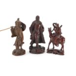 Three Chinese hardwood root carvings including two of warriors, the largest 25cm high : For