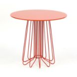 Zanotta Smallwire side table designed by Levy Arik, with circular rotating glass top in orange,