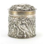 Victorian silver cylindrical box and cover, embossed with birds amongst flowers, by Goldsmith's &