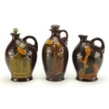 Three Royal Doulton Kingsware decanters including Micawbey Dewar's Whisky and Bonnie Prince