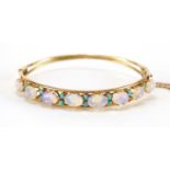 14ct gold opal and turquoise bangle, 6cm x 5cm, approximate weight 9.0g :For Further Condition