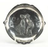 Art Nouveau pewter four footed dish by WMF, embossed with a Dutch boy and girl, impressed marks