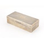 Rectangular silver cigar box, the hinge lid with engine turned decoration, by William Comyns &