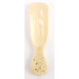 Chinese ivory shoe horn, the handle finely carved with flower heads, 15.5cm in length :For Further