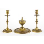19th century gilt brass desk set comprising an inkwell and pair of candlesticks, each with chased