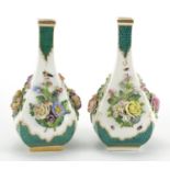 Pair of 19th century continental floral encrusted vases, each hand painted with insects, each 21cm