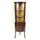 Mahogany convex corner cabinet, fitted with a glazed door above a pair of cupboard doors, 172cm H